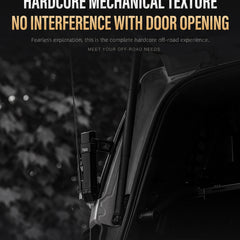 A close-up promotional photo of a black off-road vehicle door hinge area with a mounted electronic device, overlaid with marketing text reading 'HARDCORE MECHANICAL TEXTURE' and 'NO INTERFERENCE WITH DOOR OPENING.' The scene is dark and moody, with blurred foliage in the background.