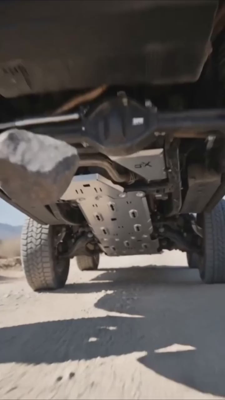 Heavy-duty 3mm steel full underbody protection kit installed on a 4x4 off-road vehicle